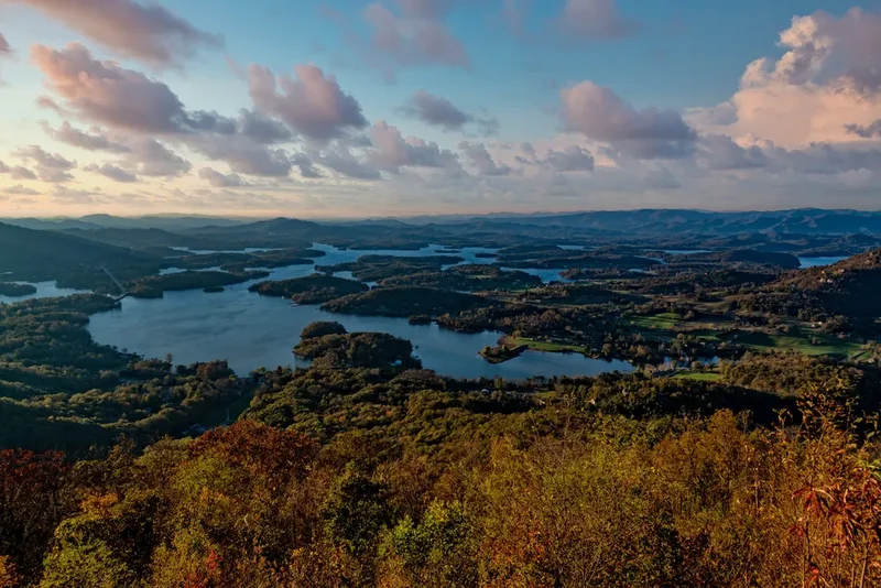 Aerial view over Hiawassee and lake during autumn sunset